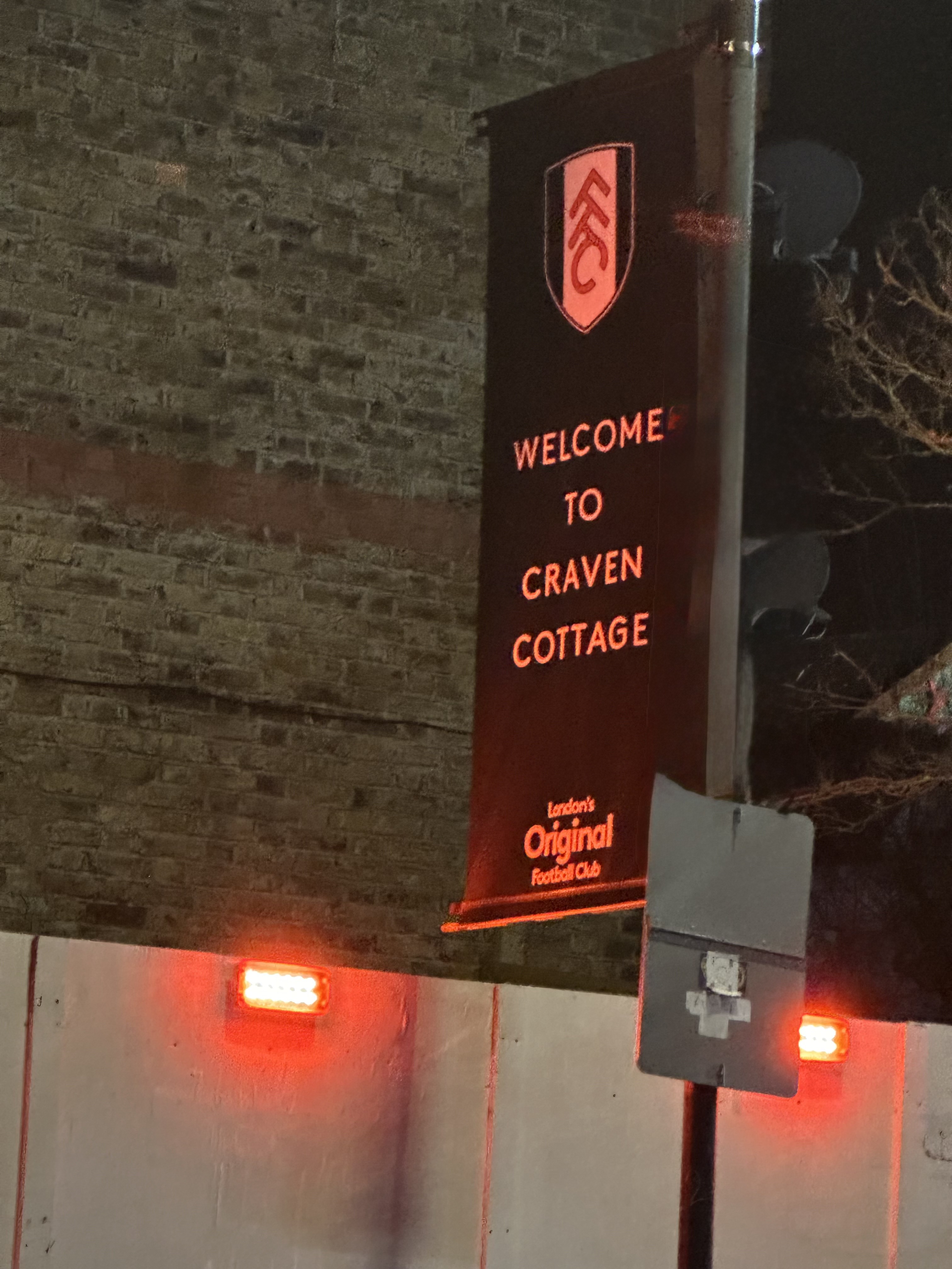 Welcome to Craven Cottage banner at night